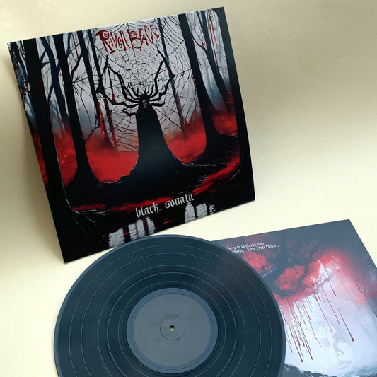 Raven Black's 'Back Sonata' - LP and jacket for the new album. Lead singer Raven is standing in the forest. She looks like a statue with antlers in front of a huge spiderweb. Black trees and silhouette. Black vinyl LP with black on black label