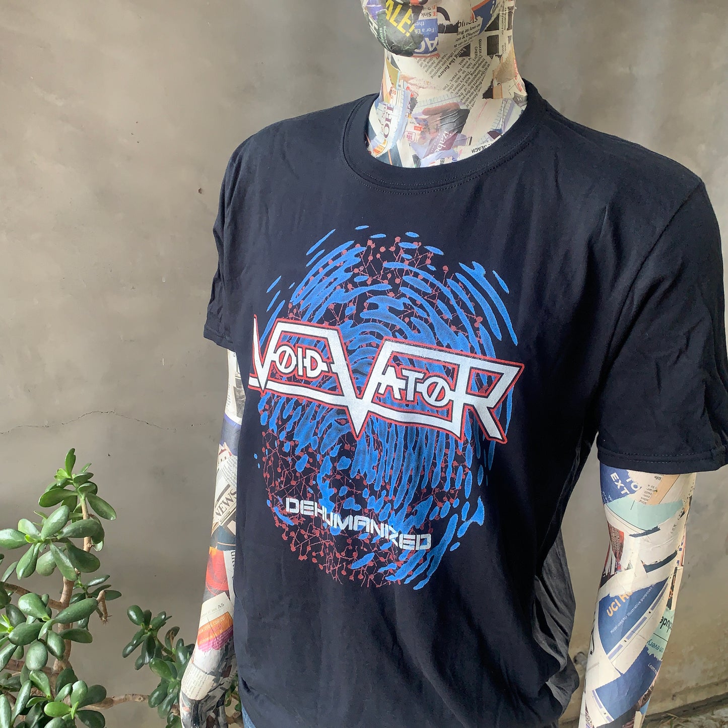 Void Vator - dehumanized black t-shirt - graphics based on dehumanized EP artwork with blue finger print , white and red logo. shirt modeled on papier maché mannequin. print on demand product from printify